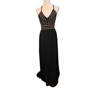 Lulus black with gold accents crossback spaghetti strap gown. Size M.